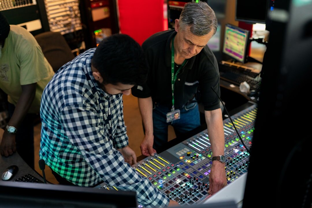 Broadcast coordination team reviewing a live run sheet