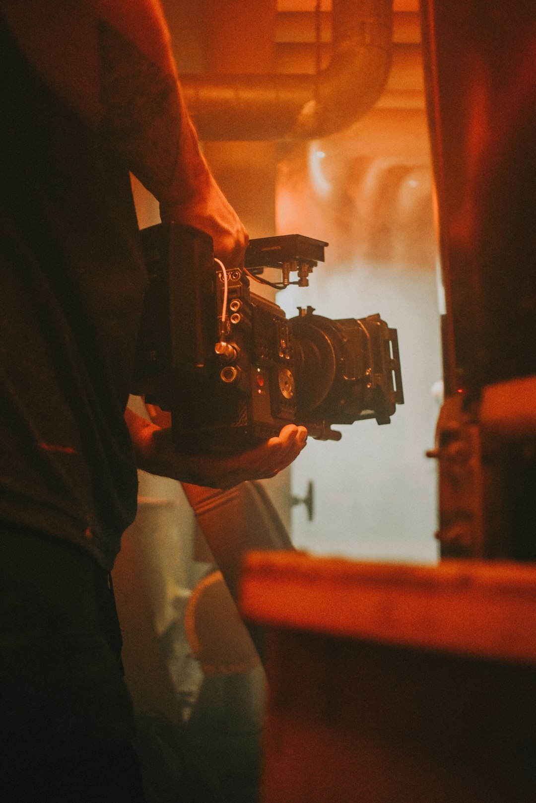 Camera operator setting up equipment for a live report